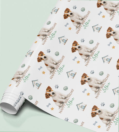 Personalised Jack Russell Terrier birthday wrapping paper featuring a cute dog, custom name and birthday message with paw prints and dog toys.