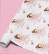 a roll of wrapping paper with a repeating pattern of a young girl in a pink dress and a crown, along with pink stars and the text "Happy 3rd Birthday Rosie".