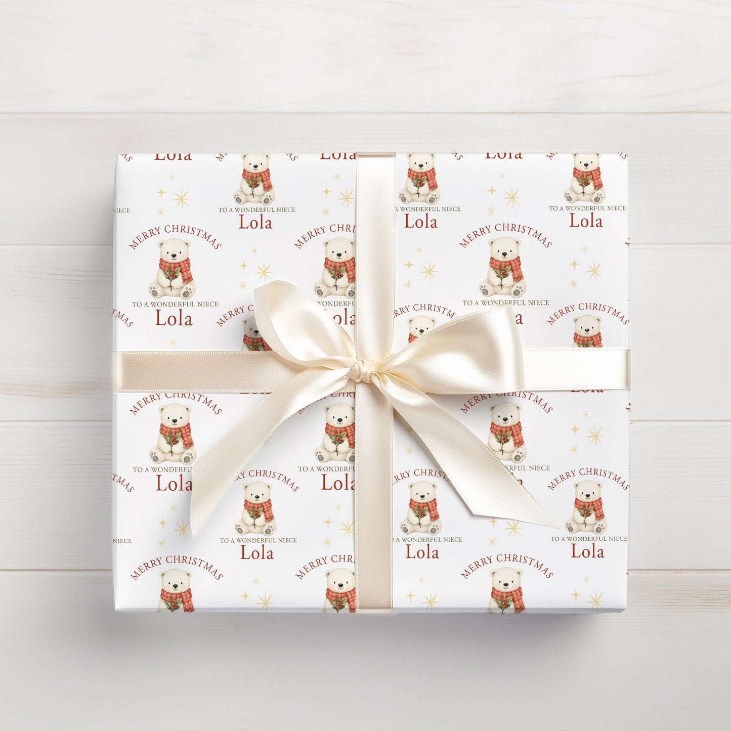Roll of personalised polar bear Christmas wrapping paper packaged in a postal tube ready for delivery.