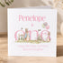 A personalized birthday card for Penelope, a rabbit character, celebrating her first birthday. The card features illustrations of Penelope and other rabbits, along with balloons and a garden scene.
