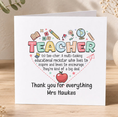 A card with a teacher's name and a heart-shaped design made up of various educational symbols, such as books, pencils, and a globe. The card expresses gratitude to a teacher, specifically Mrs Hawkes, for everything she does.