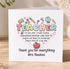 A card with a teacher's name and a heart-shaped design made up of various educational symbols, such as books, pencils, and a globe. The card expresses gratitude to a teacher, specifically Mrs Hawkes, for everything she does.