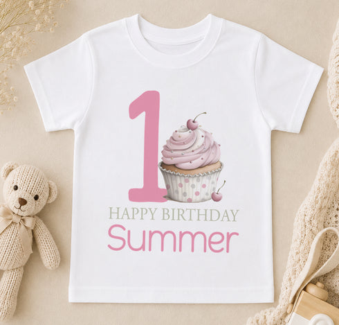 Personalised first birthday t-shirt with pink cupcake design and custom name printed on soft cotton