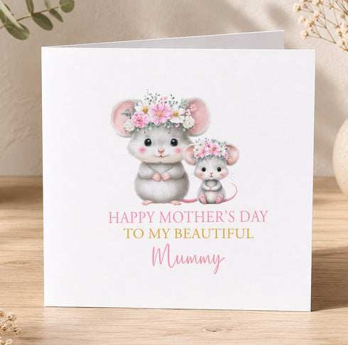 A greeting card with two mice, one larger and one smaller, wearing flower crowns. The card has a message that reads "Happy Mother's Day to my beautiful Mummy".