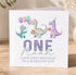 The image is a birthday card for a one-year-old named Noah, featuring illustrations of three dinosaurs and balloons.