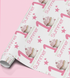 a roll of wrapping paper with a repeating pattern of pink cupcakes and stars, along with the text "Happy Summer 1st Birthday".