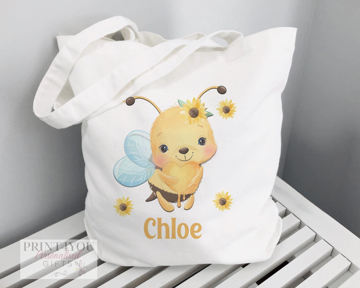 White cotton tote bag printed with a Highland cow design, non-personalised shopper