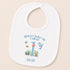A white baby bib with a personalized design featuring a cartoon image of a dolphin and the text "When I wake up I will be Jacob" along with a number 1.