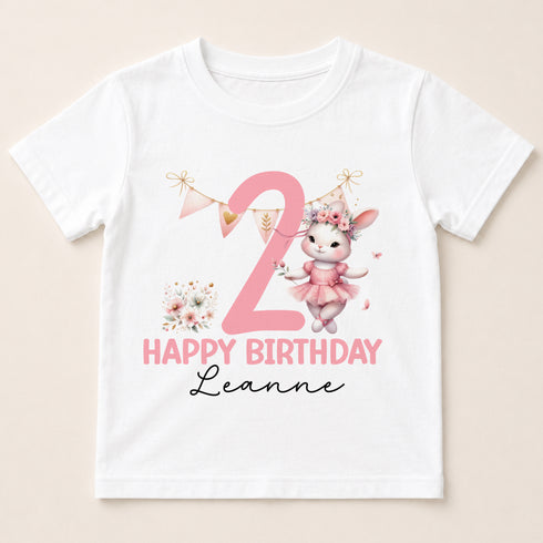 A white t-shirt with a pink bunny wearing a tutu and a pink number 2, along with the text "Happy Birthday Leanne".
