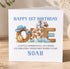 A birthday card for Noah's 1st birthday, featuring the word "ONE" made up of various objects such as balloons, a cowboy hat, and a ribbon.