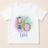 A white t-shirt with a graphic design featuring a blonde girl with blue hair and a gold number 6, along with the text " Levi 6" below the number.