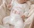 Children's clothing with the first birthday pyjamas design