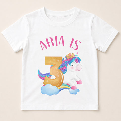 A white t-shirt with a graphic design featuring a unicorn and the number 3.