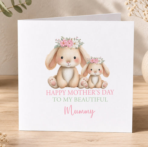 A greeting card with two rabbits wearing flower crowns, and the text "Happy Mother's Day to my beautiful Mummy" printed on it.