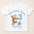 A white t-shirt with a printed design featuring a teddy bear and a soccer ball, along with the text "When I wake up I will be Harley 3".