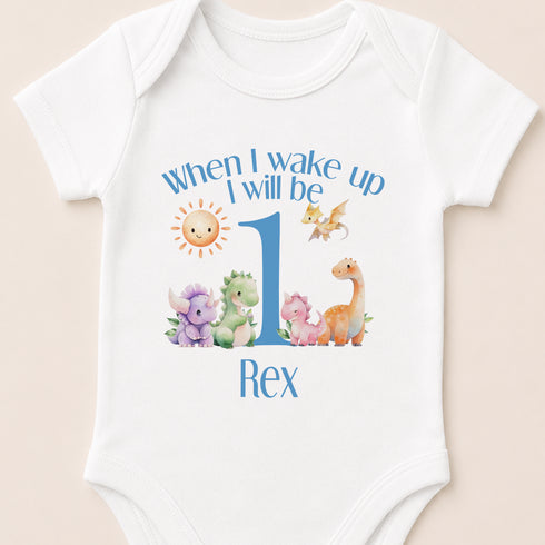 A white baby onesie with a personalized text and illustrations on it.