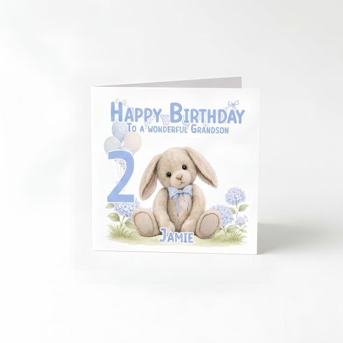 A birthday card with a teddy bear and balloons, celebrating a 2-year-old's birthday.