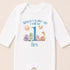 A white onesie with a personalized text and illustrations on it.