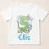 A white t-shirt with a graphic design featuring a green dinosaur and clouds, along with the text "Ellis" below the design.