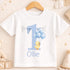 A white t-shirt with a blue number one and a yellow duck holding blue balloons, along with the name "Ollie" printed on it.