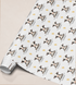 Printed cow wrapping paper shown as wrapping paper