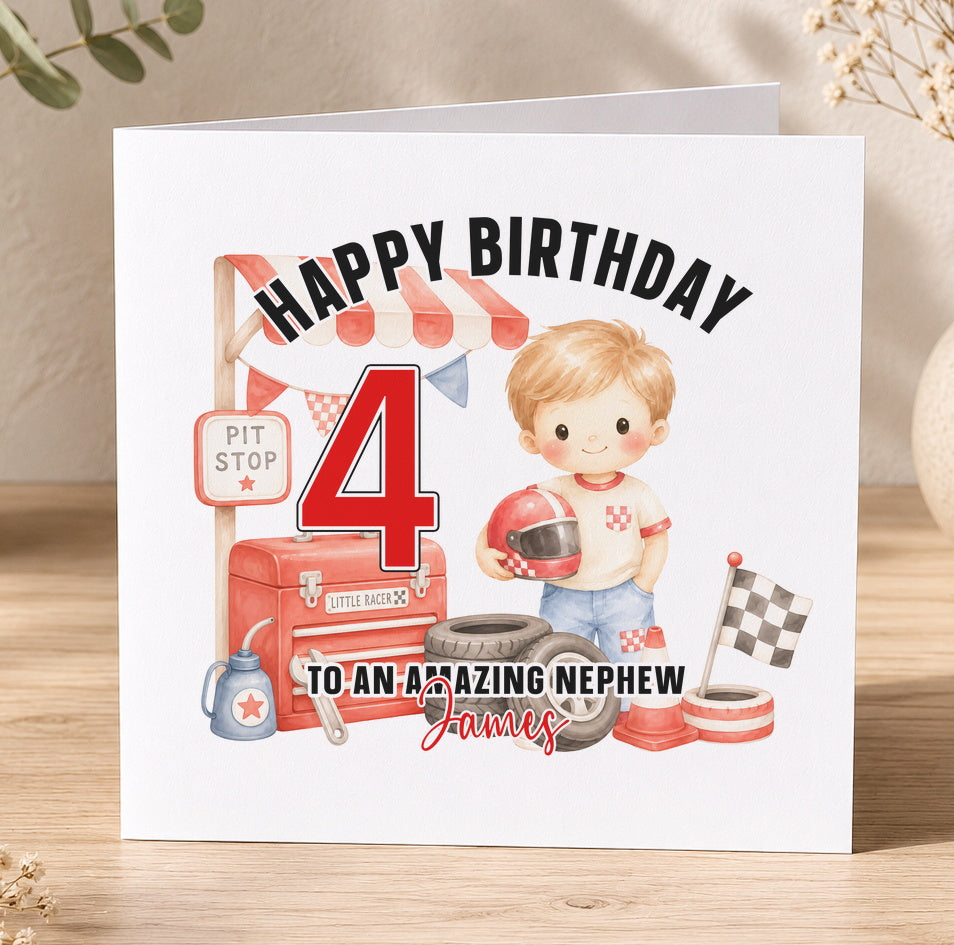 A birthday card featuring a young boy wearing a racing helmet and surrounded by racing-themed objects, such as a pit stop sign, racing tyres, and a chequered flag