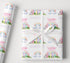 Personalised birthday wrapping paper with rainbow unicorn design, custom name and age, pastel colours, clouds and magical birthday wording.