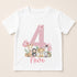 A white t-shirt with a pink number 4 and various animal illustrations, including giraffes, zebras, and elephants, along with pink balloons.