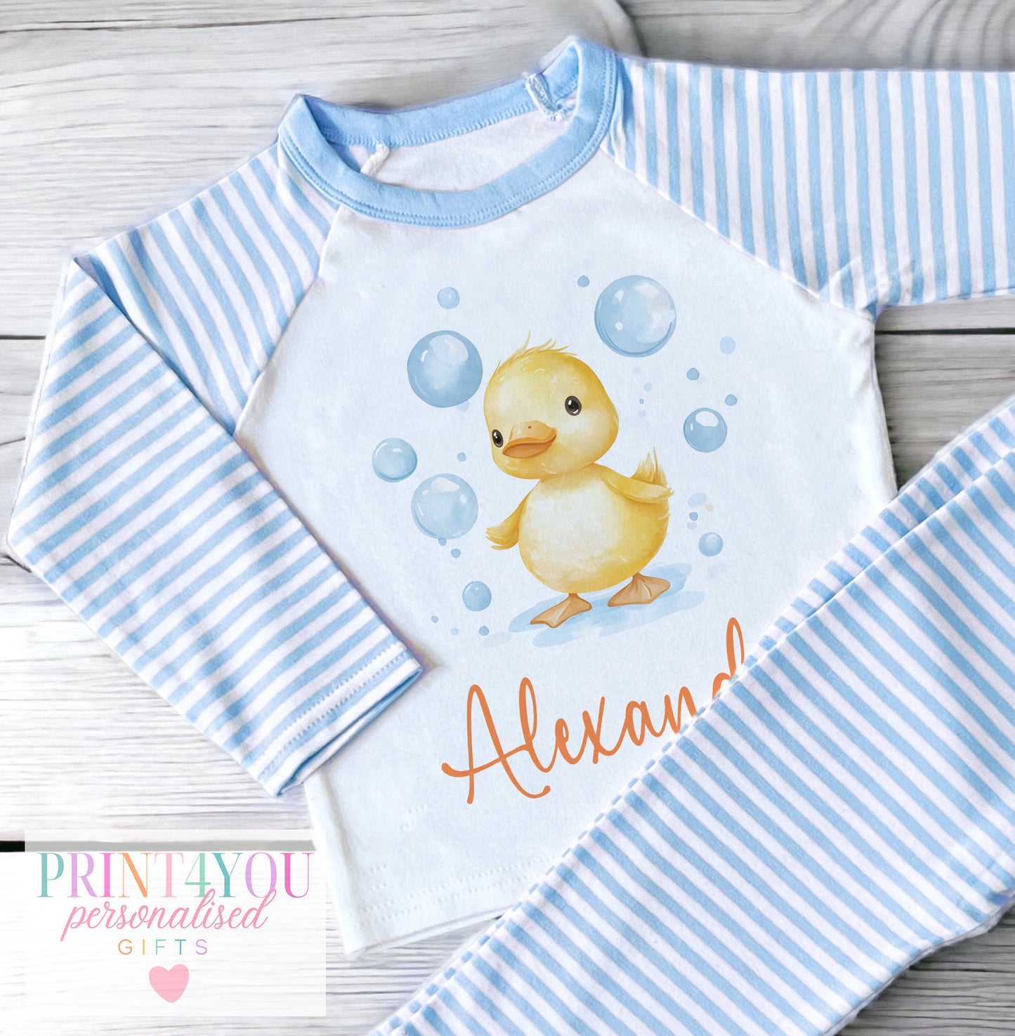 Personalised blue and white striped baby clothing with bubble duck design