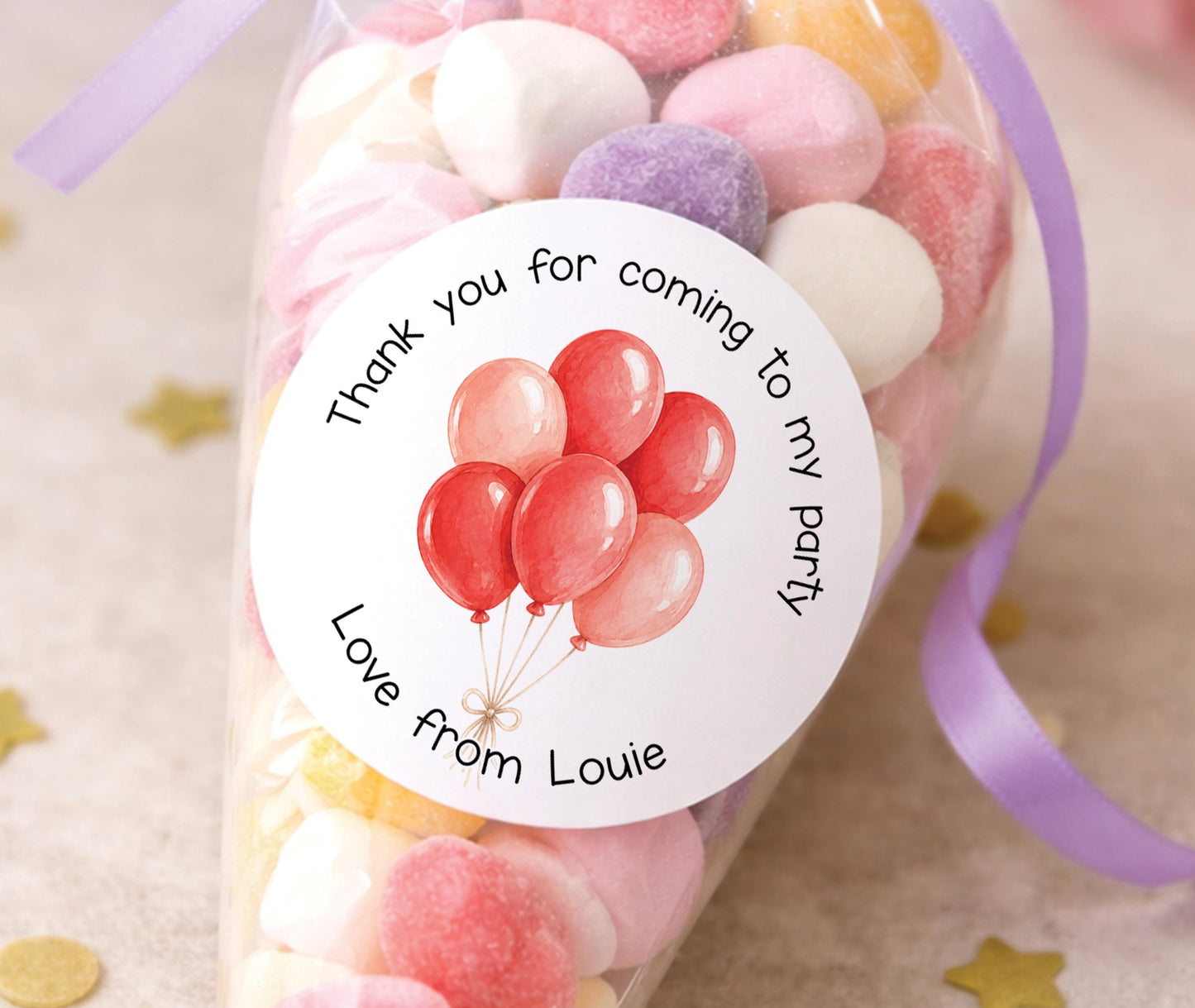 Round glossy stickers featuring a colourful balloon design, personalised with a child's name, for birthday party bags