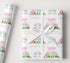 Personalised birthday wrapping paper with rainbow unicorn design, custom name and age, pastel colours, clouds and magical birthday wording.