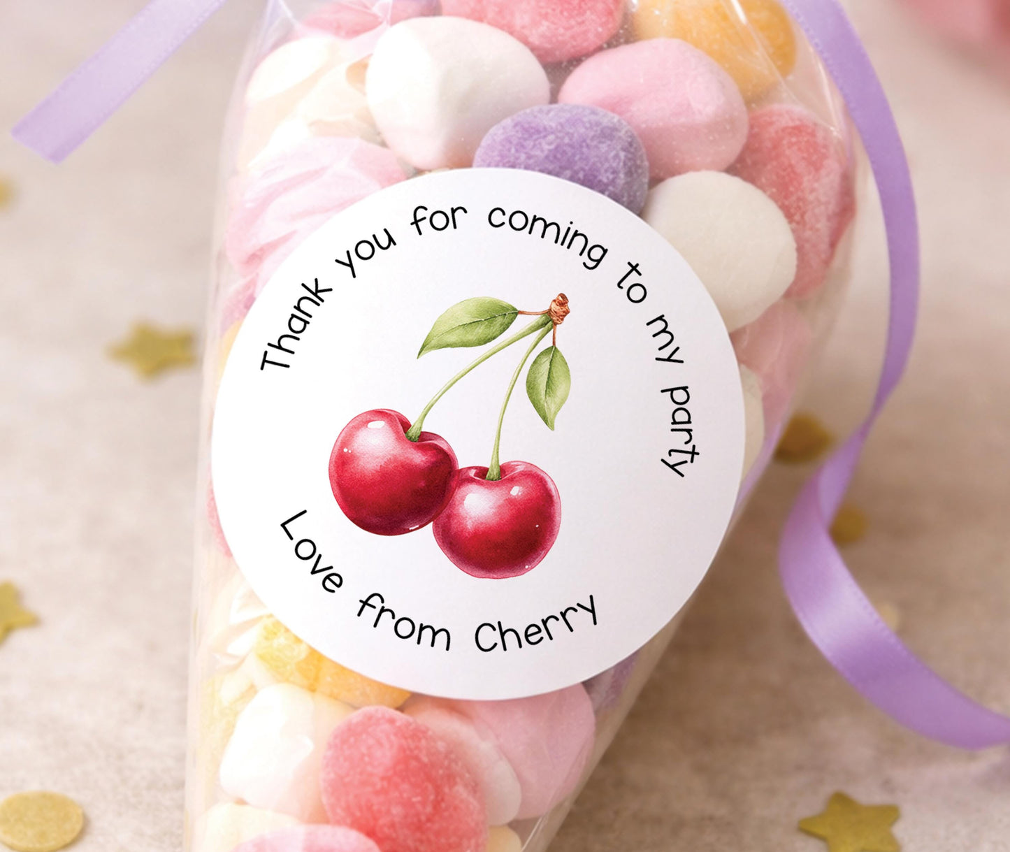 Sheet of personalised glossy round cherry thank you stickers shown printed with a sample name