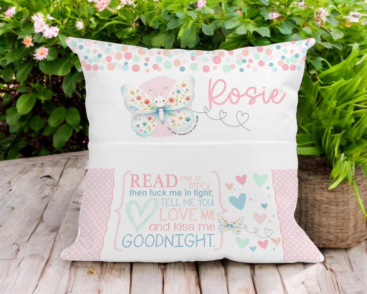 Personalised butterfly book cushion styled on a child's bed
