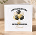 The image is a graduation card with a congratulatory message and an illustration of balloons.