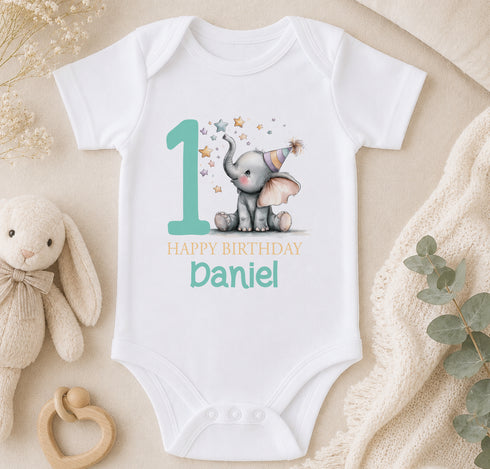 Personalised first birthday vest with elephant design and custom name, styled with soft toys and greenery