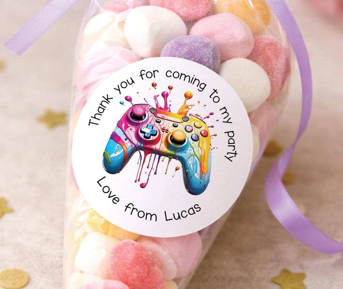 Round glossy stickers featuring a video game controller design, personalised as thank-you party labels