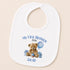 A white baby bib with a personalized design featuring a teddy bear and a blue balloon, along with the text "My First Birthday Jacob 2016".