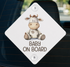 a sticker with a cartoon cow and the text "BABY ON BOARD" printed on it.