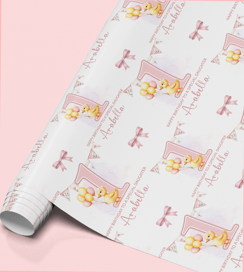 a roll of wrapping paper with a repeating pattern of a yellow duck holding balloons and the name "Abella" written on it.