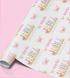 The image is a roll of wrapping paper with a repeating pattern of butterflies and the name "Amelia" written on it.
