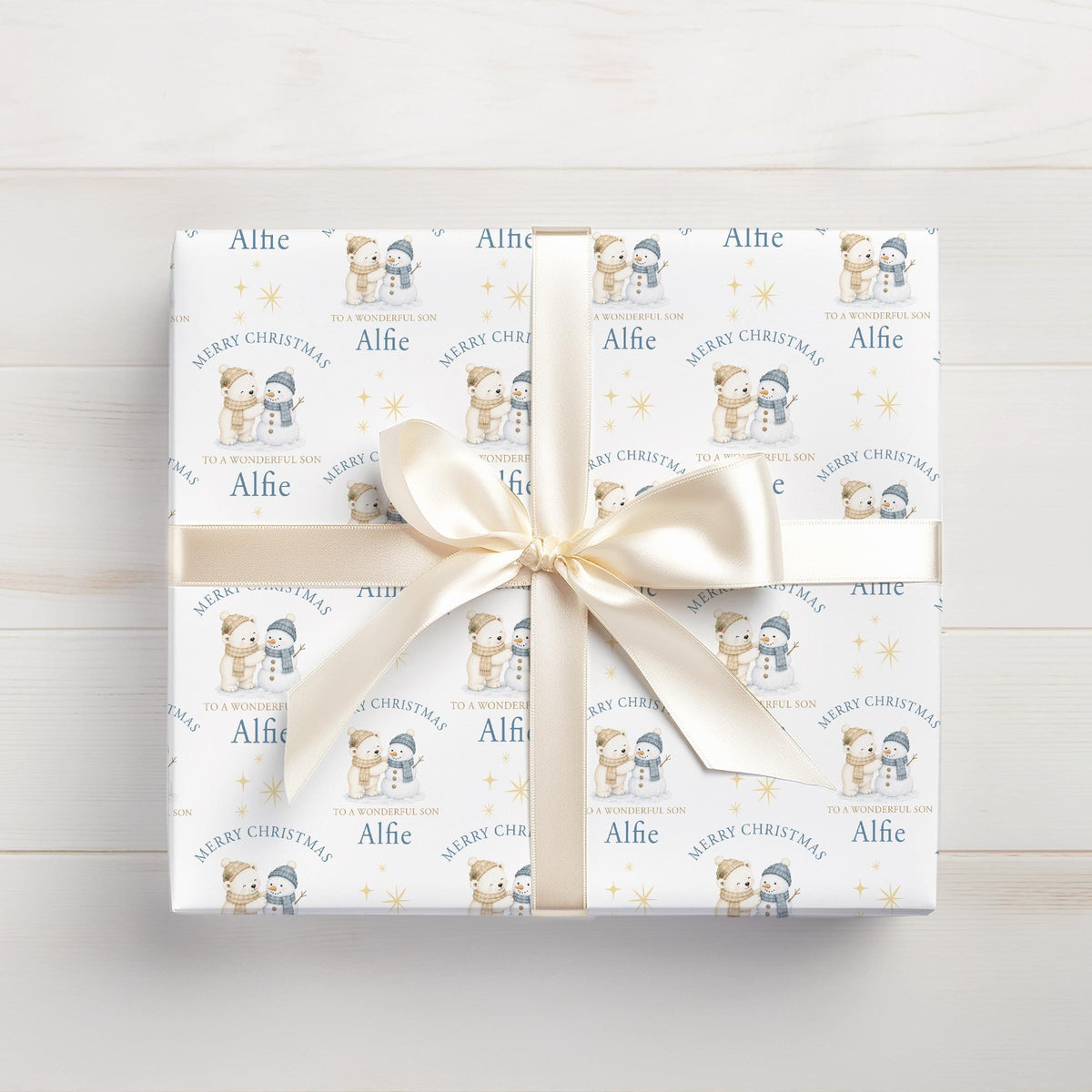 Personalised Christmas gift wrap featuring polar bear and snowman design with custom name, rolled and ready to post