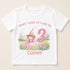 A white t-shirt with a printed design featuring a young girl in a pink dress and a pink number 3, along with the text "When I wake up I will be Clover" and a pink number 3.