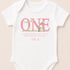 A white onesie with a pink bunny and the word "ONE" printed on it.