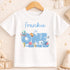 A white t-shirt with a personalized text and illustrations related to a child's birthday theme.