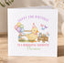 A birthday card with a yellow duck wearing a party hat and surrounded by colorful balloons, flowers, and a wagon, along with the text "Happy 2nd Birthday to a wonderful daughter Florence".