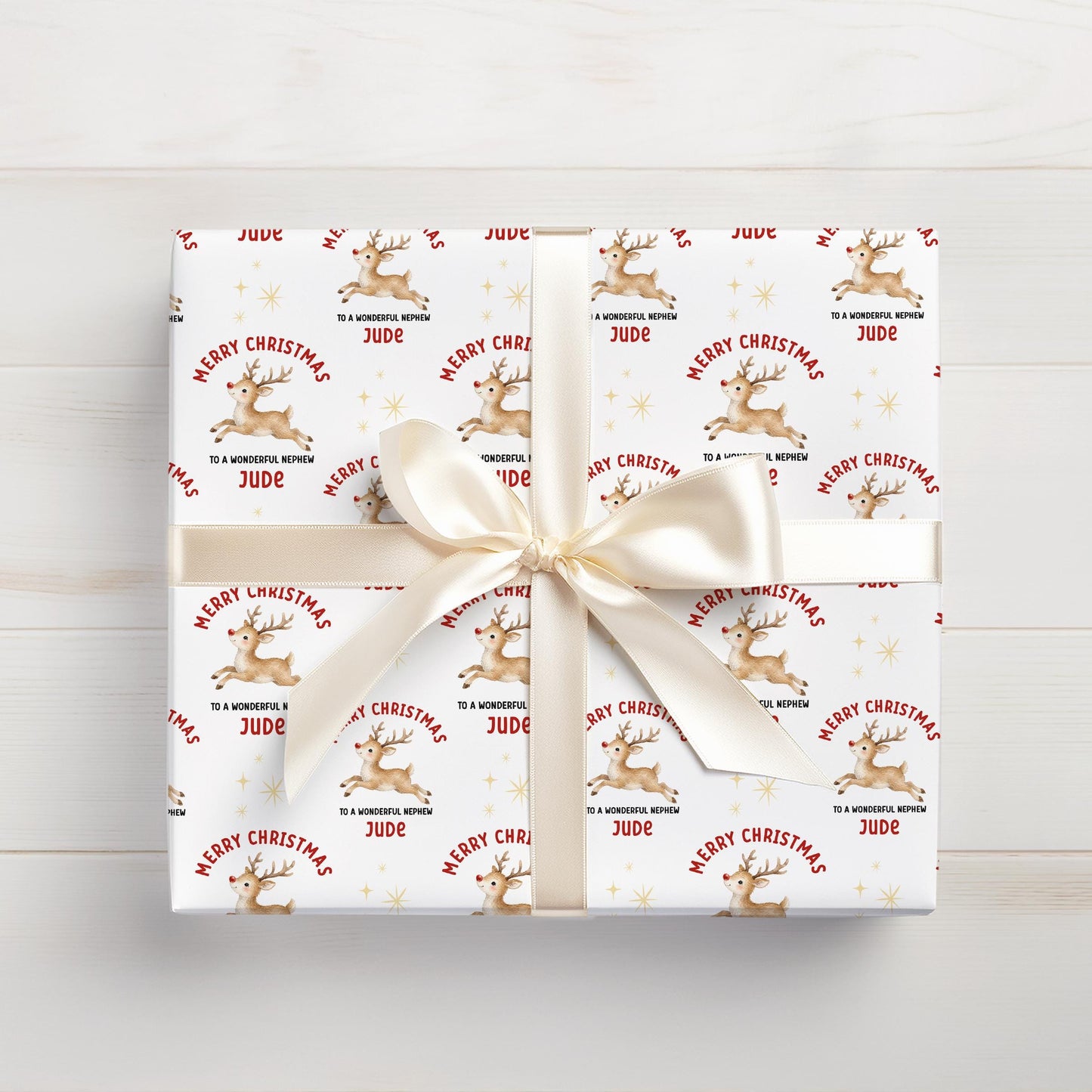 Personalised Christmas gift wrap featuring reindeer design with custom name, rolled and ready to post