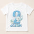 A white t-shirt with a blue whale and starfish design, along with the text "JAXON" printed on it.