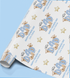 a roll of wrapping paper with a repeating pattern of teddy bears and stars, along with the text "Happy Father's Day" and "Love Andrew" printed on it.