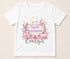 Personalised Halloween t-shirt featuring cute ghost holding wooden sign, pink pumpkins, flowers and custom name on white children's Halloween shirt