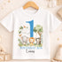 A white t-shirt with a graphic design featuring a blue number one surrounded by various animals, including an elephant, lion, and zebra, along with the text "BIRTHDAY BOY Lucas".